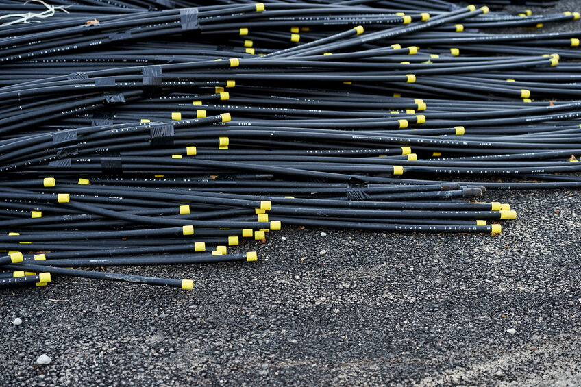 Fiber optic cable laying on ground