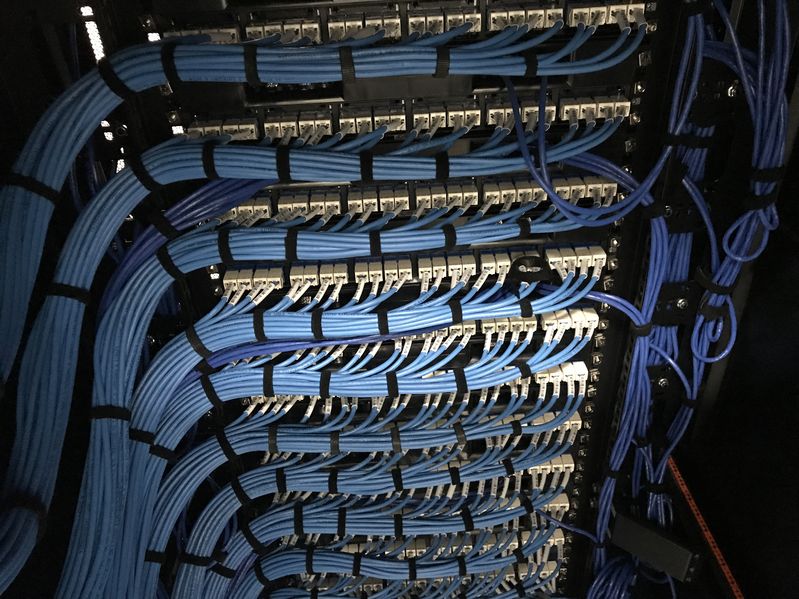 A large server cabinet with organized cables
