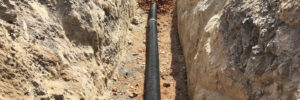 A cable laid in an underground cabling trench.